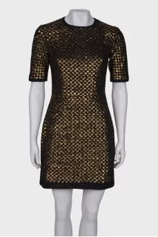 Dress is decorated with sequins