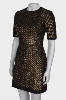 Dress is decorated with sequins