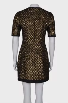 Dress is decorated with sequins
