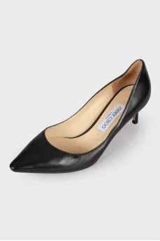 Black leather pumps