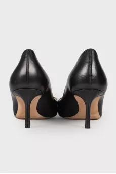 Black leather pumps