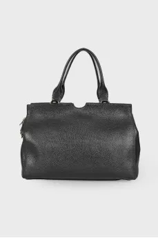 Leather bag with golden keyring