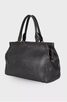 Leather bag with golden keyring