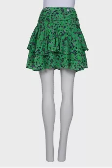 Green skirt with ruffles in print