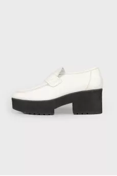 Black and white leather pumps