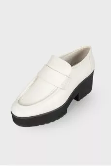 Black and white leather pumps