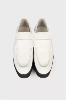 Black and white leather pumps