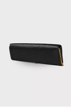 Textile clutch with decor