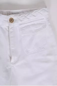 White jeans with a decorative belt