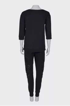 Suit with rhinestones in the shape of a skull