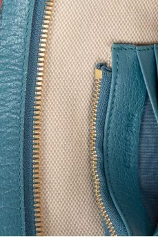 Textile knitted clutch