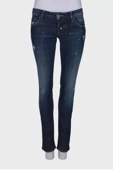 Dark blue ripped and stained jeans