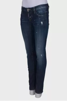 Dark blue ripped and stained jeans
