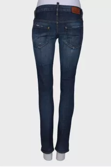 Dark blue ripped and stained jeans