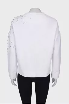 White sweatshirt with appliqué