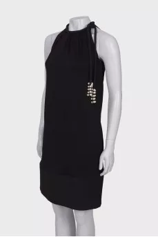 Black dress with ties and pearls
