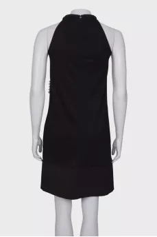 Black dress with ties and pearls