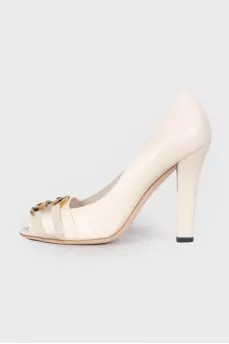 Leather shoes with gold-tone hardware