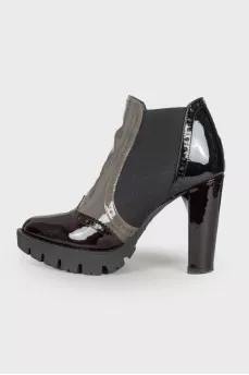 Perforated patent leather ankle boots