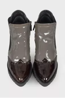Perforated patent leather ankle boots