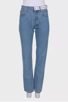 Blue jeans with brand logo