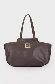 Leather bag with golden logo