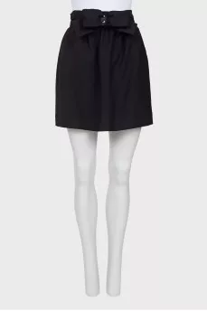 Skirt is decorated with a bow