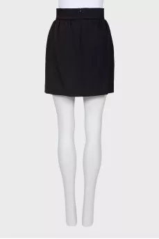 Skirt is decorated with a bow