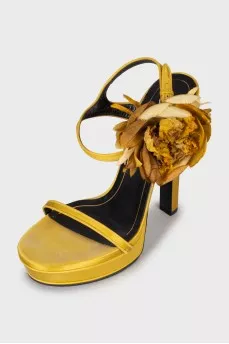 Yellow sandals decorated with flowers