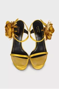 Yellow sandals decorated with flowers