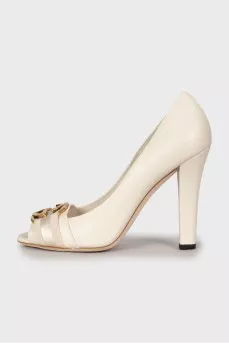White shoes with golden logo