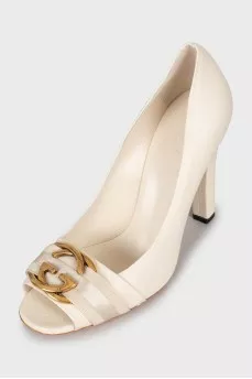 White shoes with golden logo