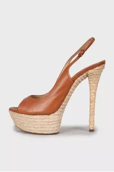 Leather sandals with woven soles