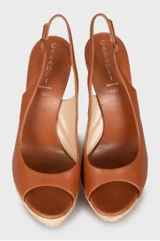 Leather sandals with woven soles