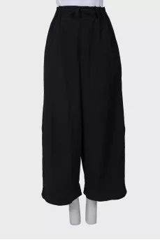 Black trousers with drawstring bottom