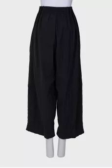 Black trousers with drawstring bottom