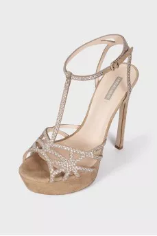 Suede sandals decorated with rhinestones