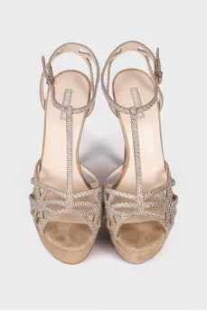 Suede sandals decorated with rhinestones