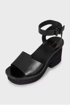 Black sandals with woven soles
