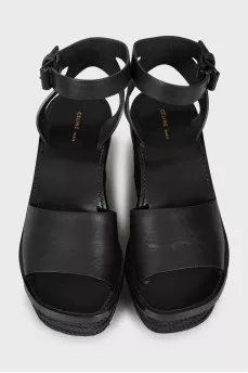Black sandals with woven soles