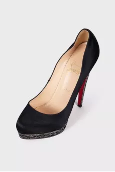 Textile shoes are decorated with rhinestones