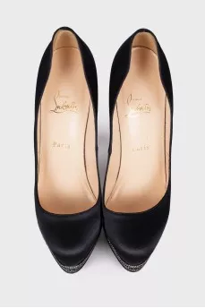 Textile shoes are decorated with rhinestones
