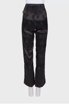 Black trousers in floral print