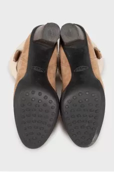 Suede ankle boots with fur heel