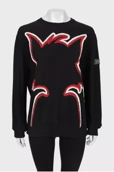 Black sweater with seams facing out