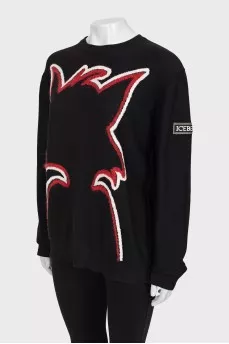 Black sweater with seams facing out