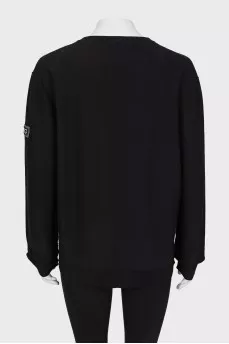 Black sweater with seams facing out