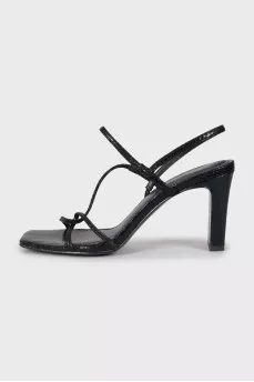Black sandals with snakeskin embossing