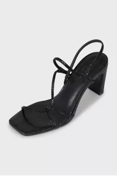 Black sandals with snakeskin embossing