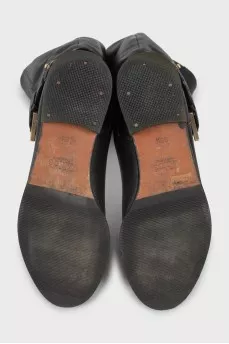 Black leather boots with buckle